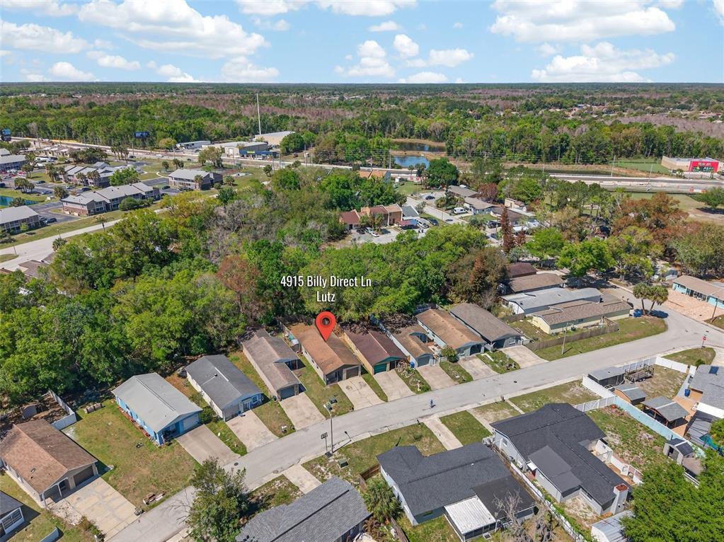 4915 Billy Direct Lane Lutz, FL 33559 - Photo 66 of 73 an aerial view of a house with a lake view