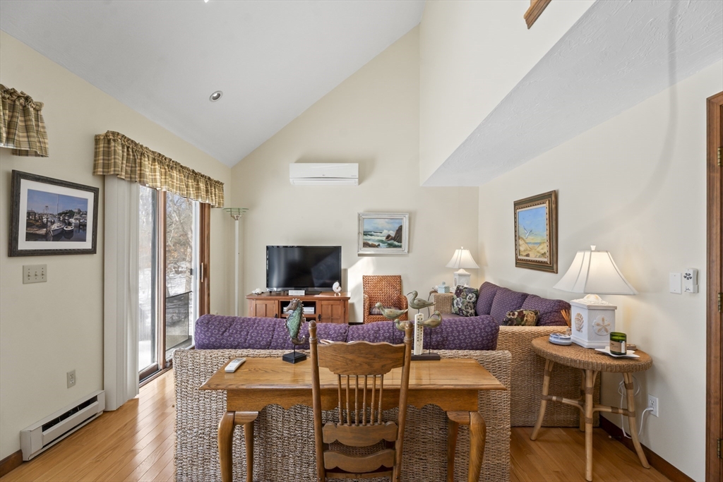 52 Windsor Drive Edgartown, MA 02539 - Photo 5 of 11 a living room with furniture a wooden floor and a flat screen tv