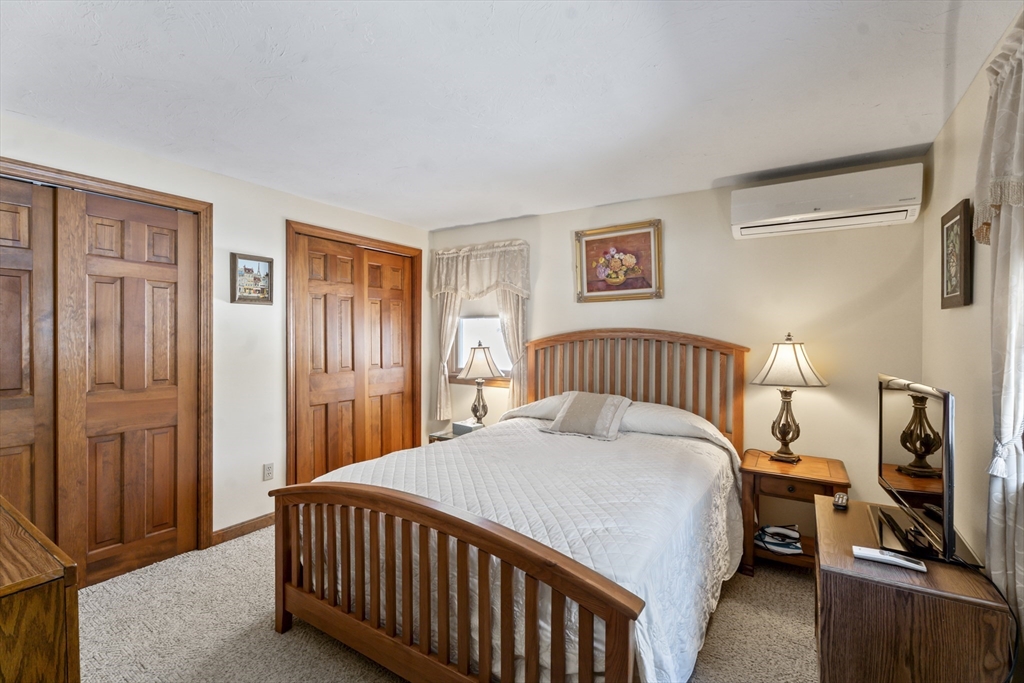52 Windsor Drive Edgartown, MA 02539 - Photo 7 of 11 a bedroom with a bed and a window