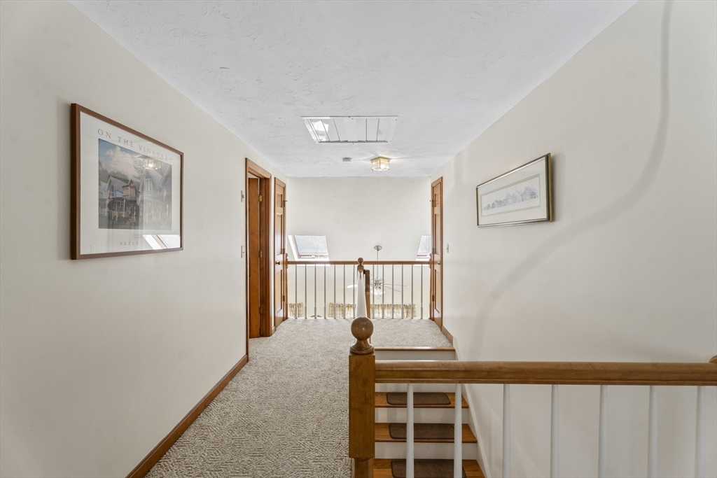 52 Windsor Drive Edgartown, MA 02539 - Photo 8 of 11 a view of a hallway with windows
