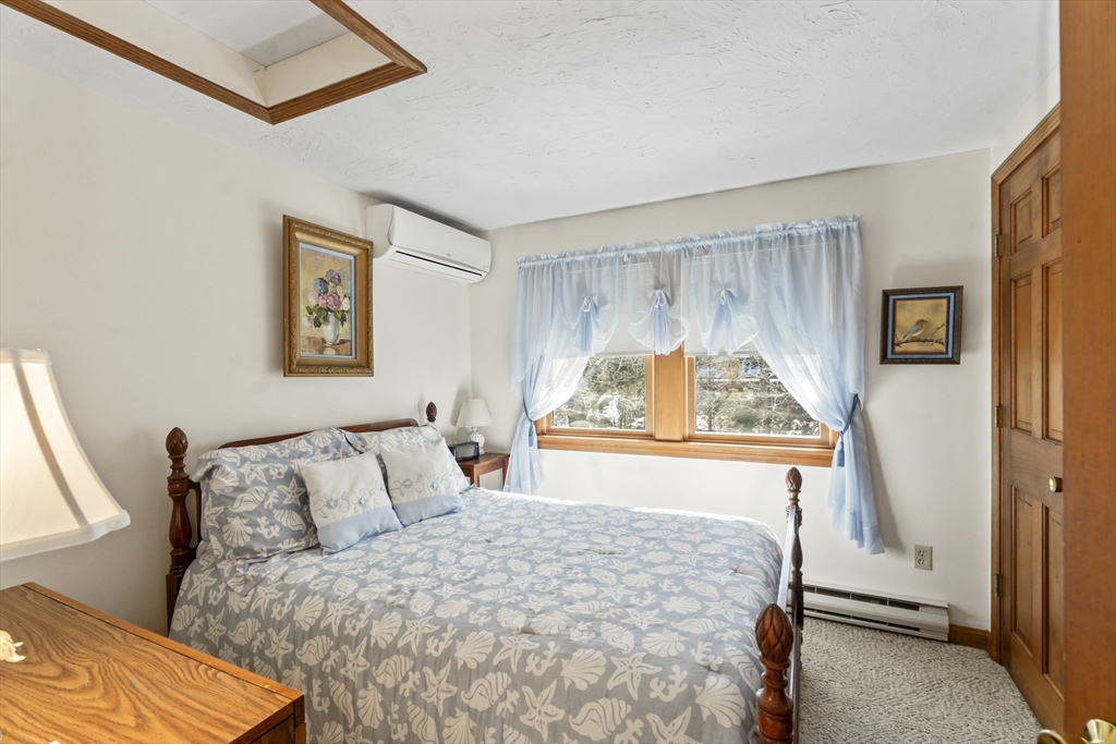 52 Windsor Drive Edgartown, MA 02539 - Photo 9 of 11 a bedroom with a bed and a window