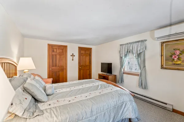 a bathroom with a toilet and a shower curtain