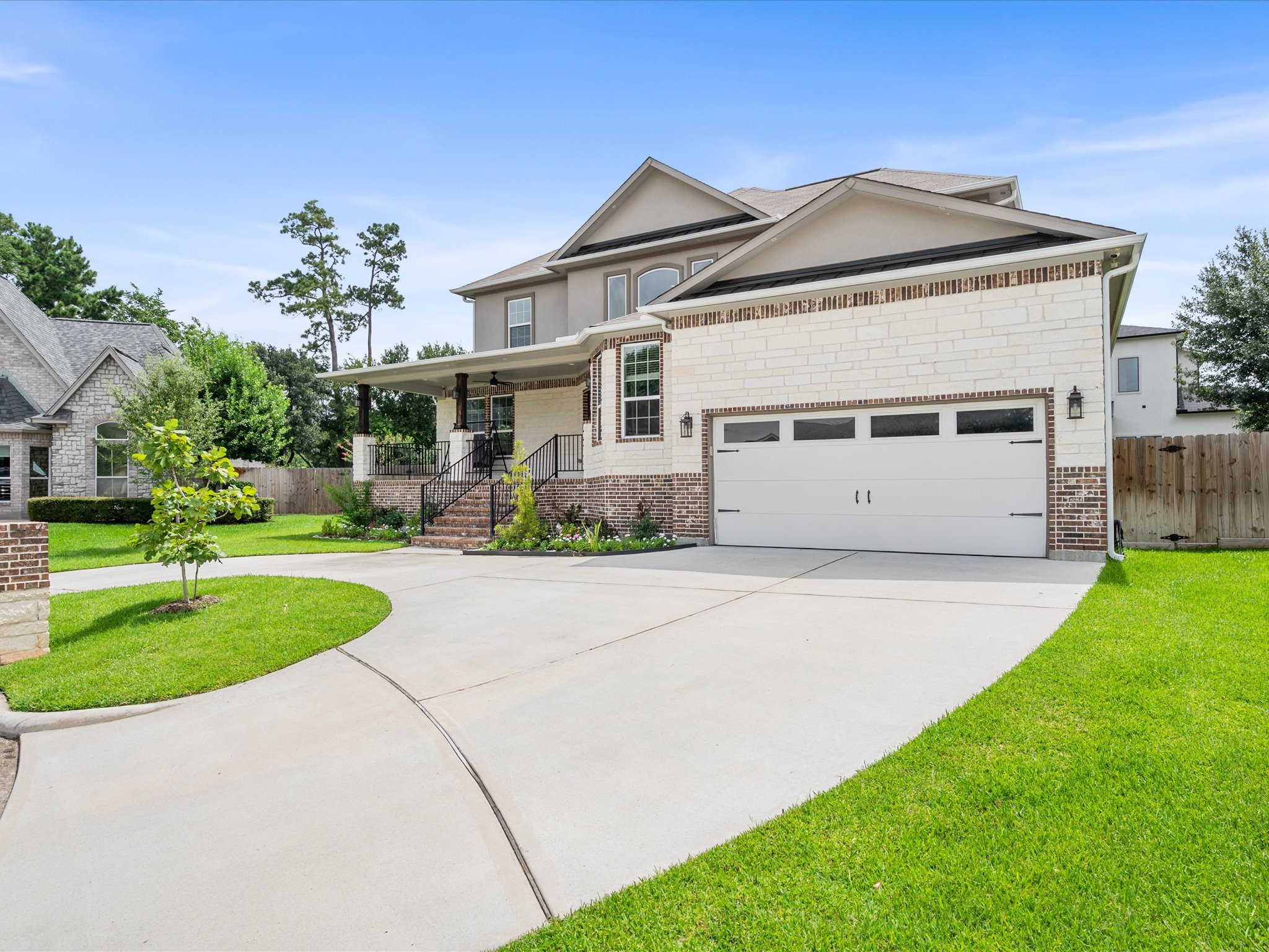 Thoughtfully maintained inside and out, the home showcases manicured landscaping, a two-car garage, and the added convenience of EV charging.