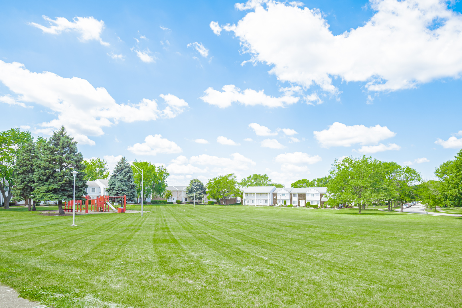 447 Yorkshire Square Bolingbrook, IL 60440 - Photo 23 of 23 a view of yard with swimming pool and green space