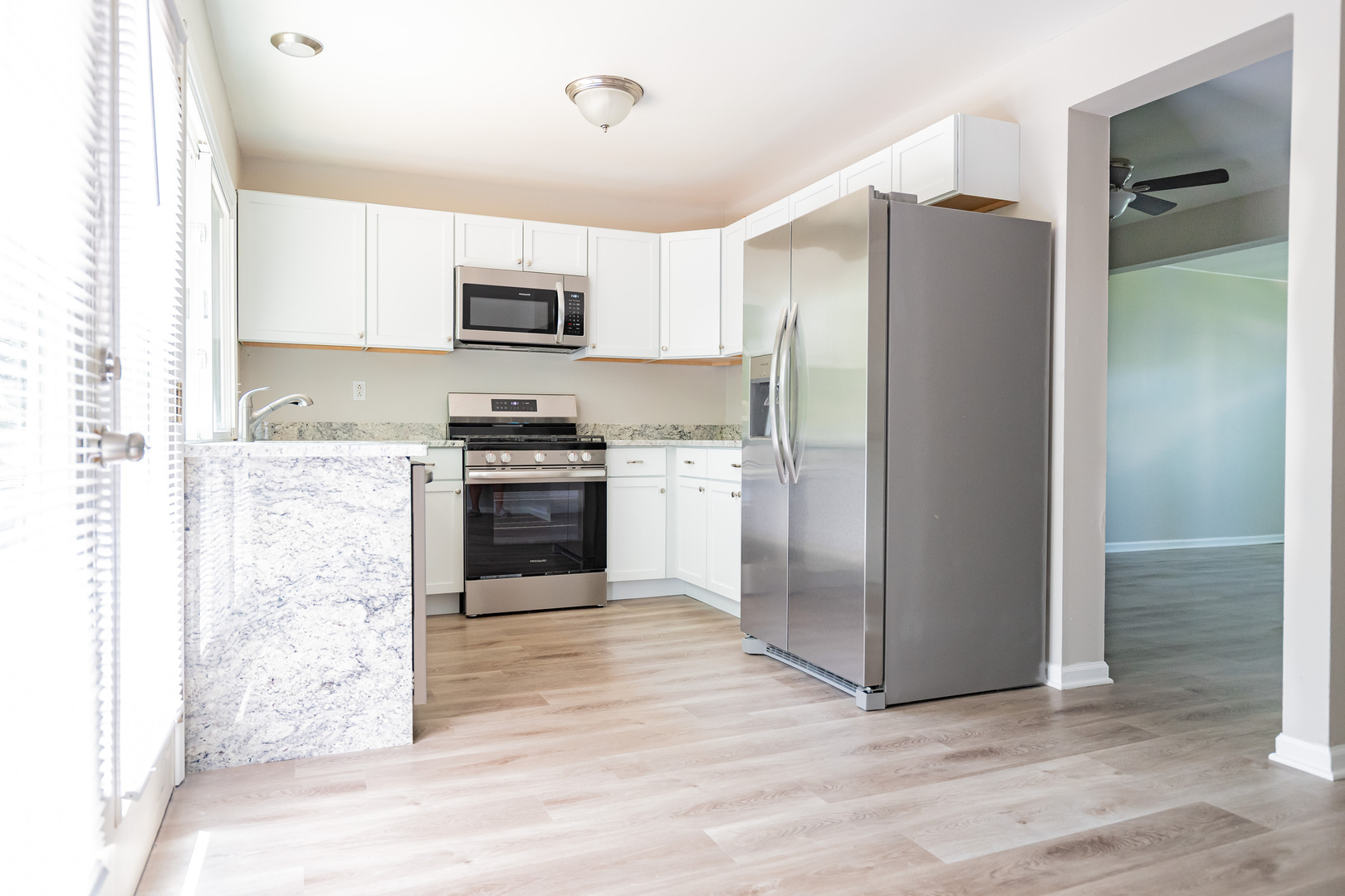 447 Yorkshire Square Bolingbrook, IL 60440 - Photo 6 of 23 a kitchen with stainless steel appliances granite countertop a refrigerator stove and sink