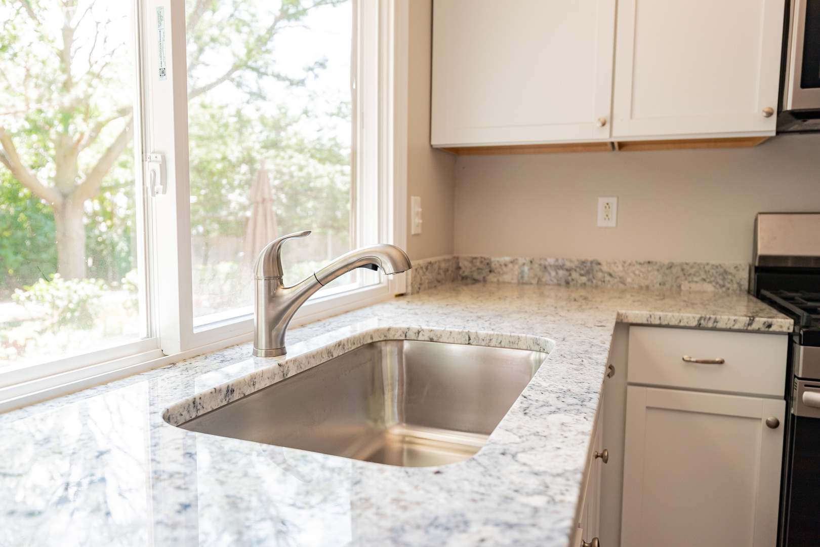447 Yorkshire Square Bolingbrook, IL 60440 - Photo 7 of 23 a kitchen with a sink cabinets and a window