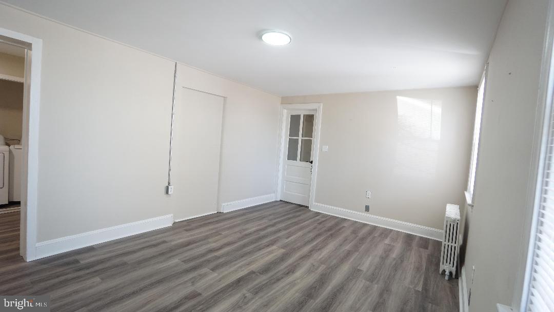 104 Bethlehem Pike, Unit B Colmar, PA 19446 - Photo 3 of 12 an empty room with wooden floor and windows