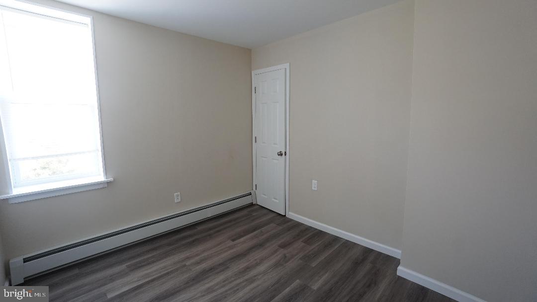 104 Bethlehem Pike, Unit B Colmar, PA 19446 - Photo 8 of 12 a view of a room that has wooden floor and a window