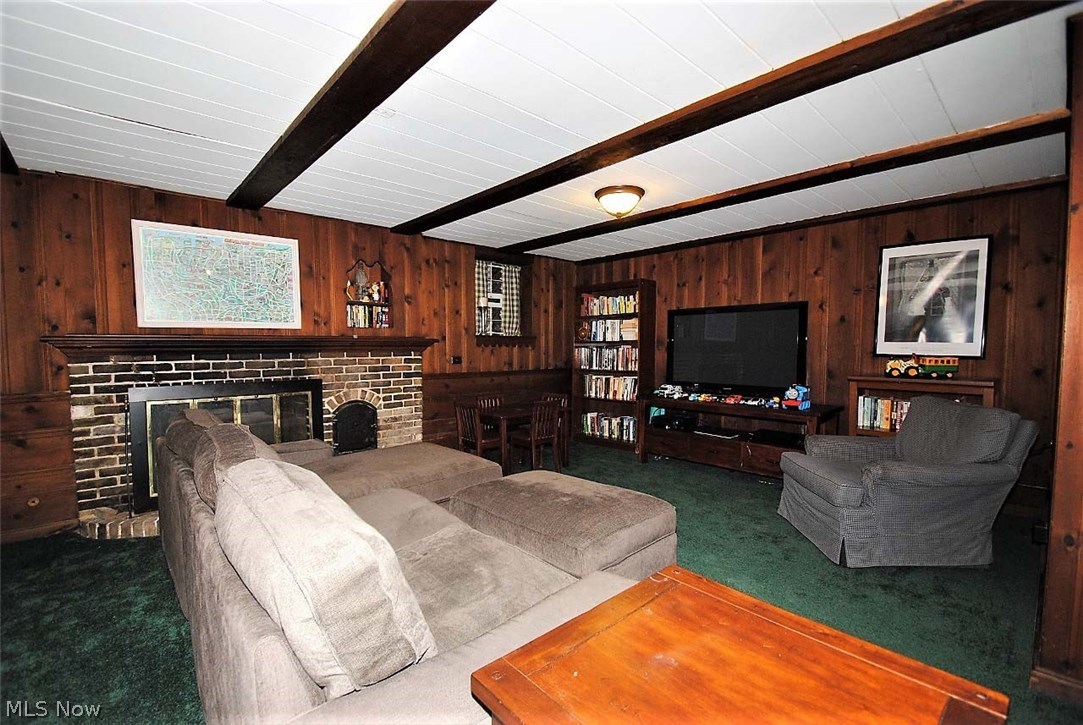 3664 Traver Road Shaker Heights, OH 44122 - Photo 21 of 24 Lower level rec room with paneled walls and fireplace.