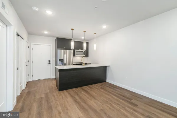 a view of kitchen with wooden floor