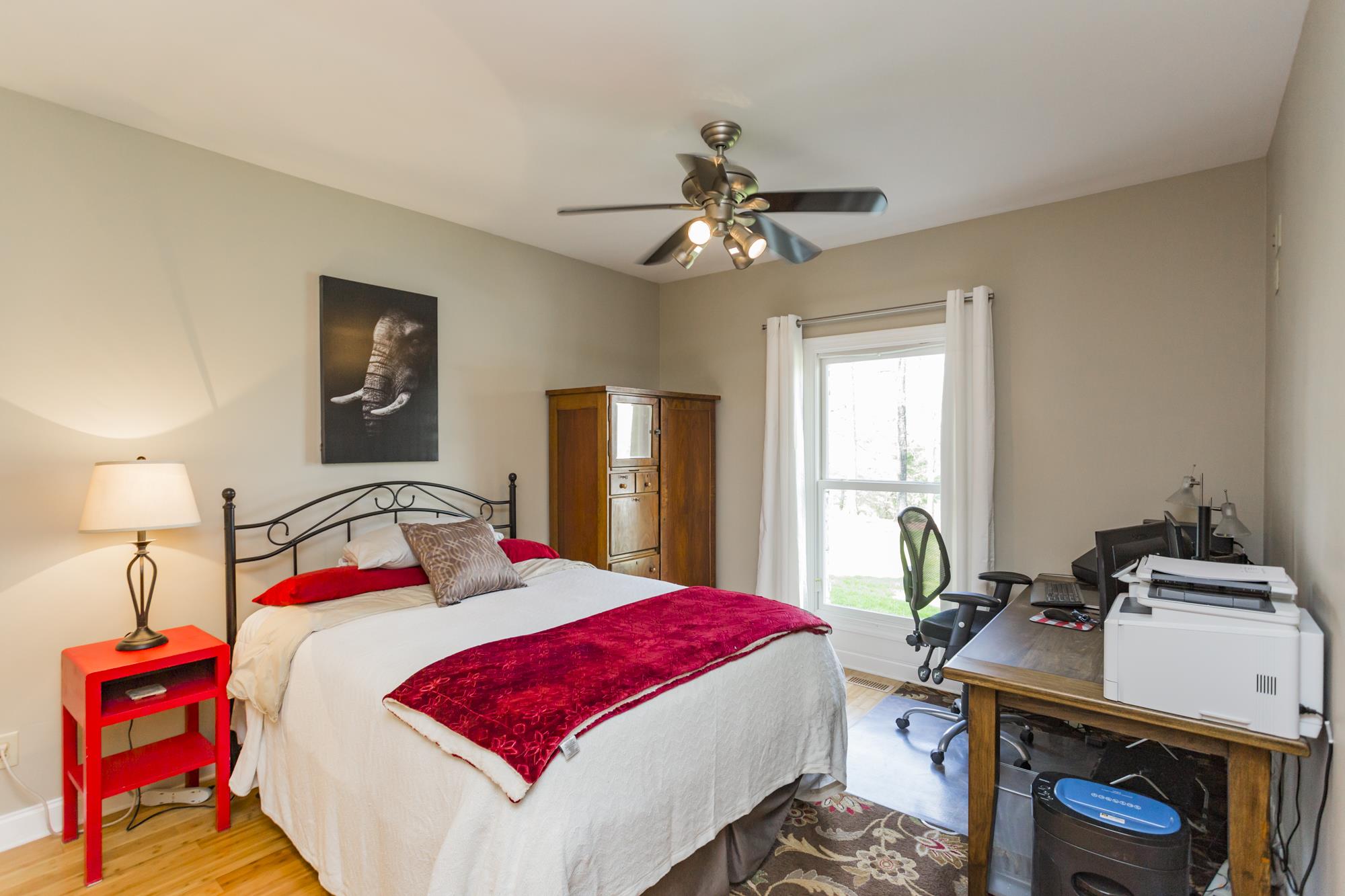 4240 Warren Road Franklin, TN 37067 - Photo 14 of 22 a bedroom with a bed and a chandelier