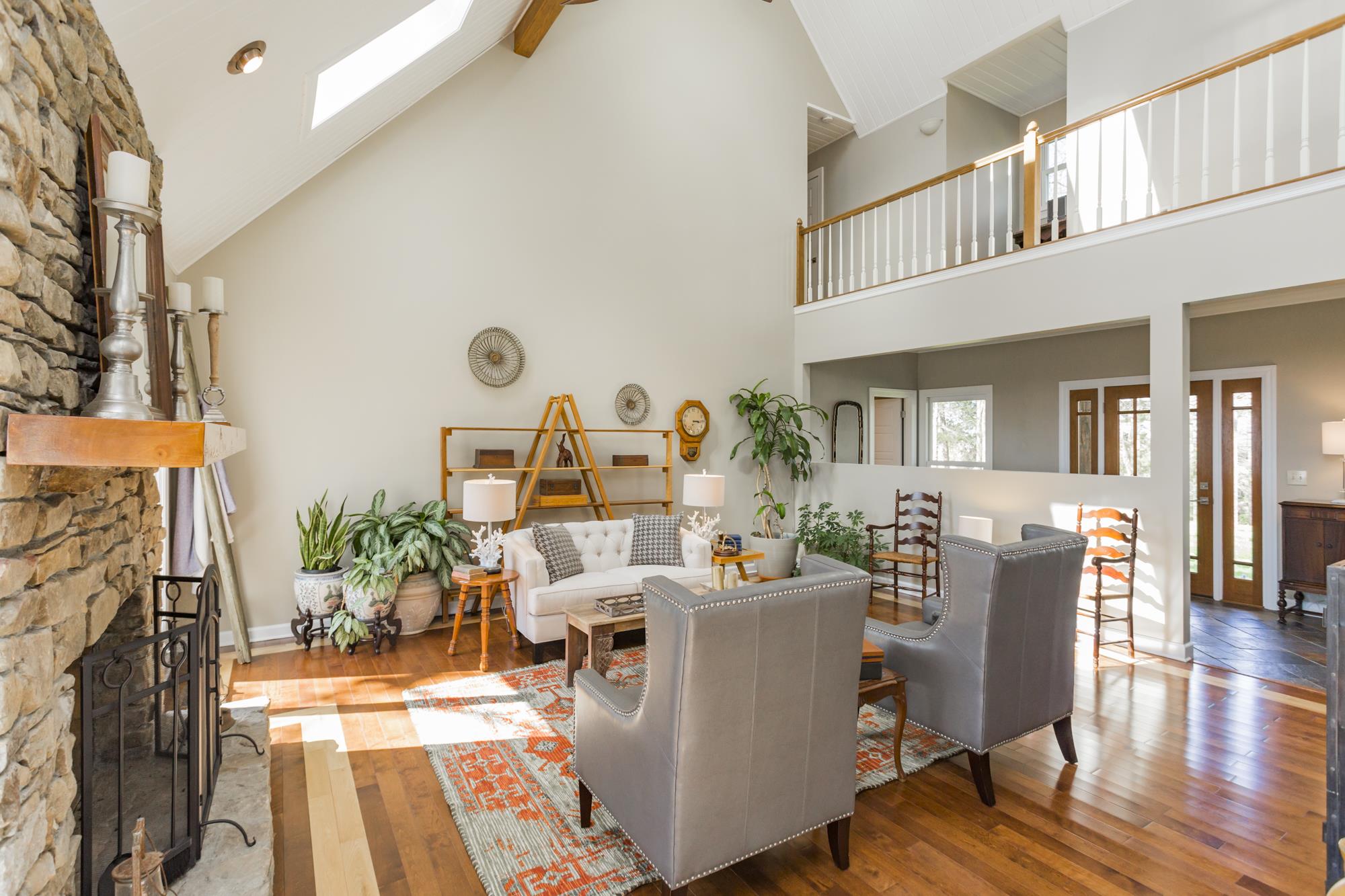 4240 Warren Road Franklin, TN 37067 - Photo 3 of 22 a living room with furniture a fireplace and wooden floor