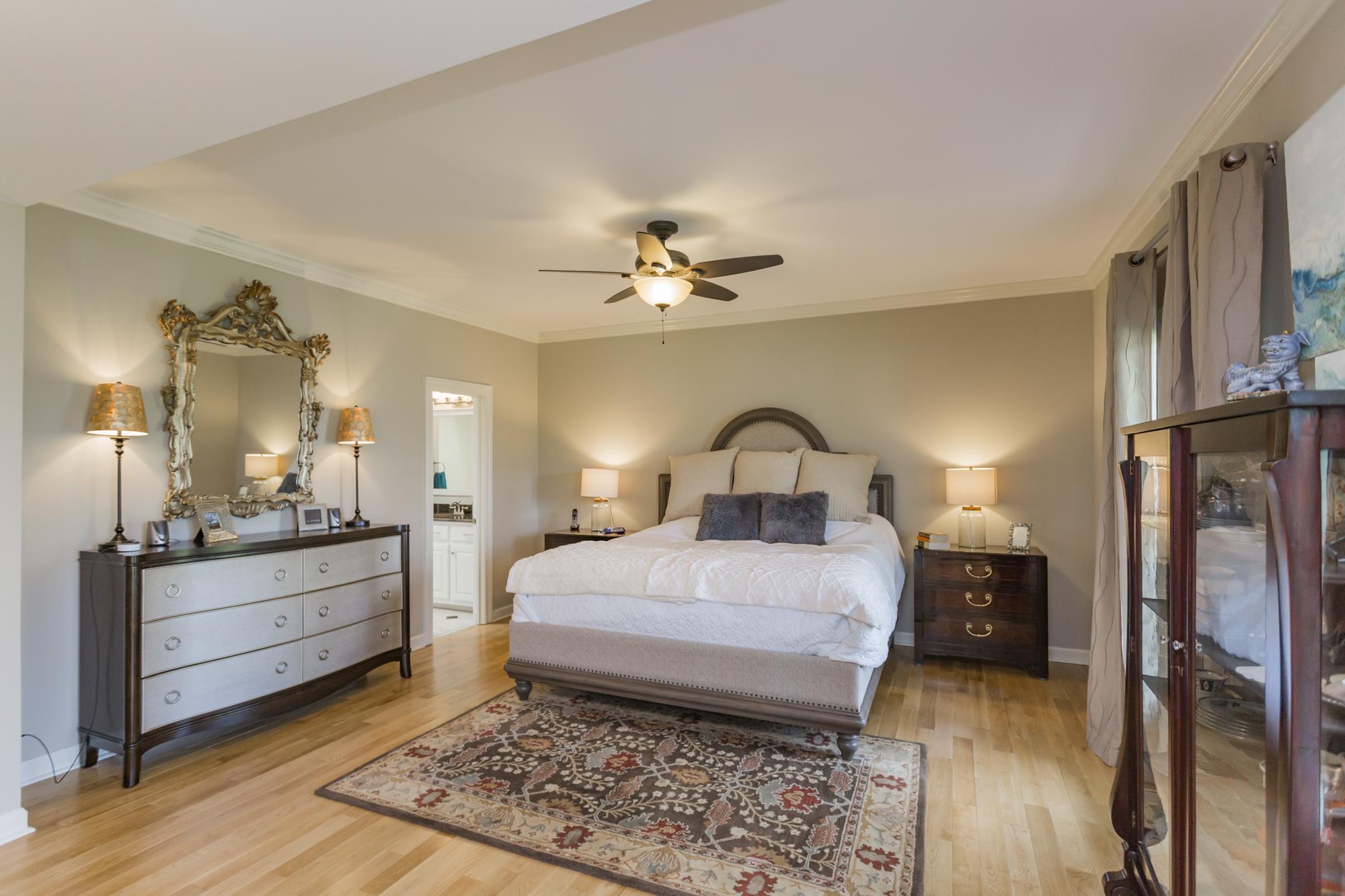 4240 Warren Road Franklin, TN 37067 - Photo 8 of 22 a bedroom with a bed and a chandelier