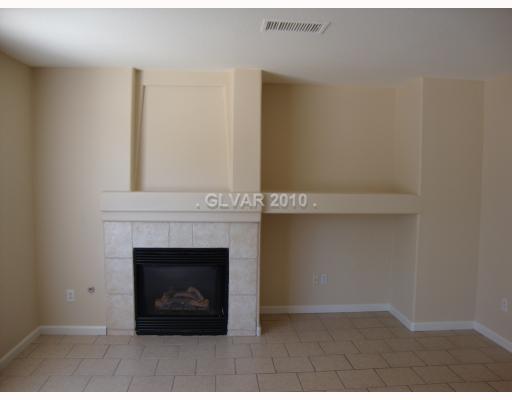 993 Ridge Path Avenue Henderson, NV 89015 - Photo 4 of 11 Interior Space/Layout. New Gas Fireplace and tile floors.
