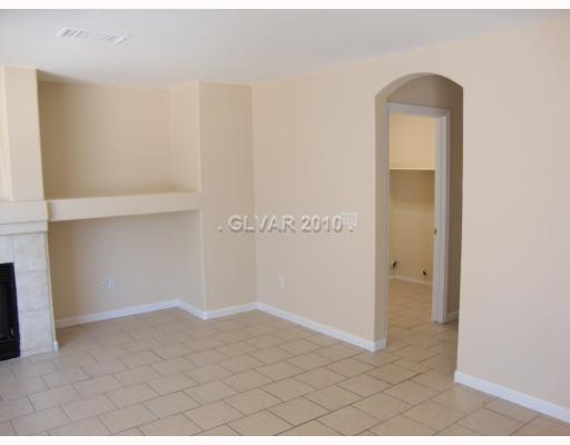 993 Ridge Path Avenue Henderson, NV 89015 - Photo 5 of 11 Interior Space/Layout. Nicely titled flooring downstairs with separate laundry room. Space for your flat screen and electronics.