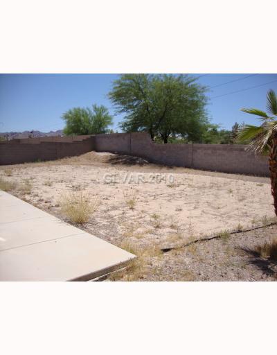 993 Ridge Path Avenue Henderson, NV 89015 - Photo 9 of 11 Exterior Back. Great yard for a pool, dogs, kids. Large lot to make your own!