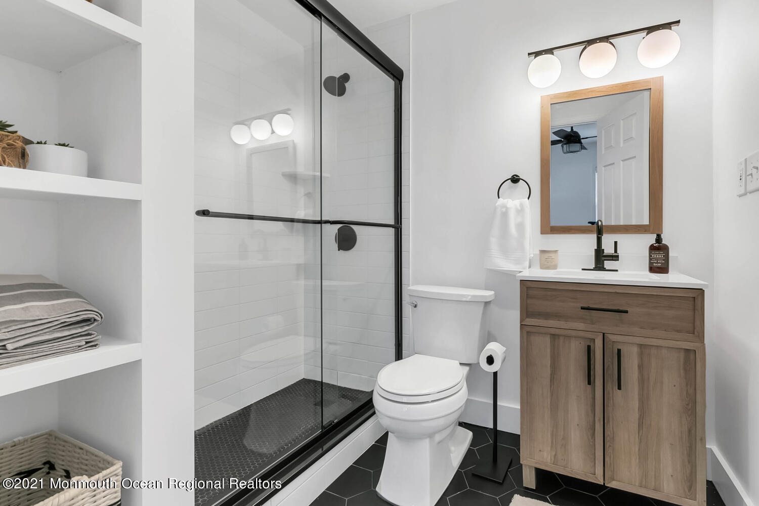 114 Garden Road Shrewsbury, NJ 07702 - Photo 14 of 25 a bathroom with a toilet sink and shower