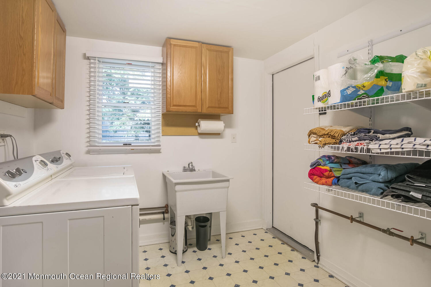 114 Garden Road Shrewsbury, NJ 07702 - Photo 17 of 25 a room with a washing machine and sink