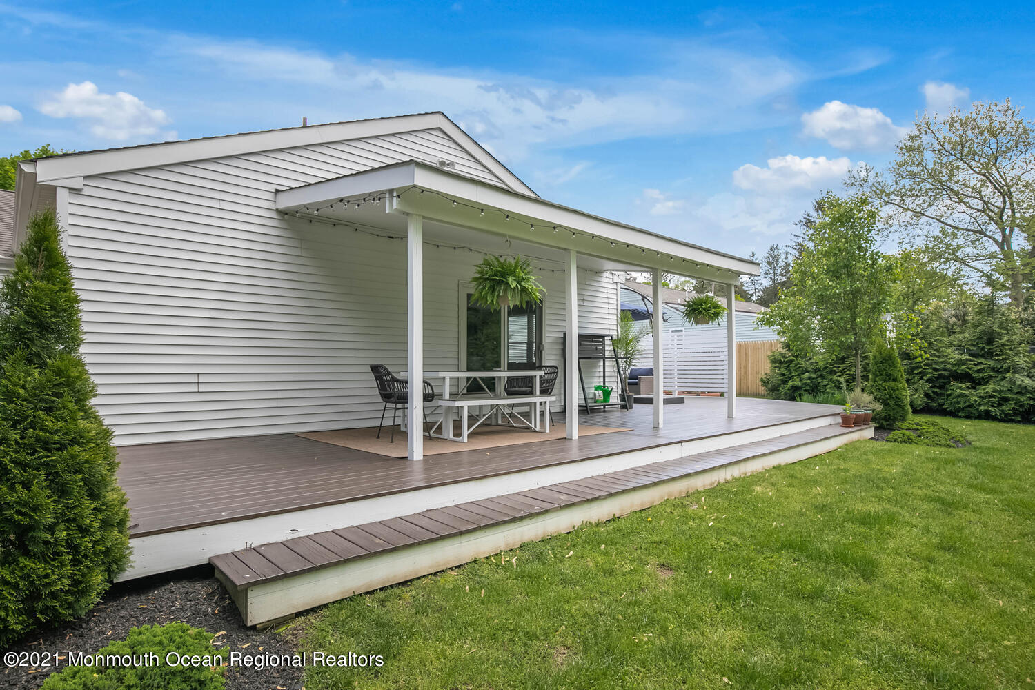 114 Garden Road Shrewsbury, NJ 07702 - Photo 19 of 25 a view of a house with a yard and sitting area