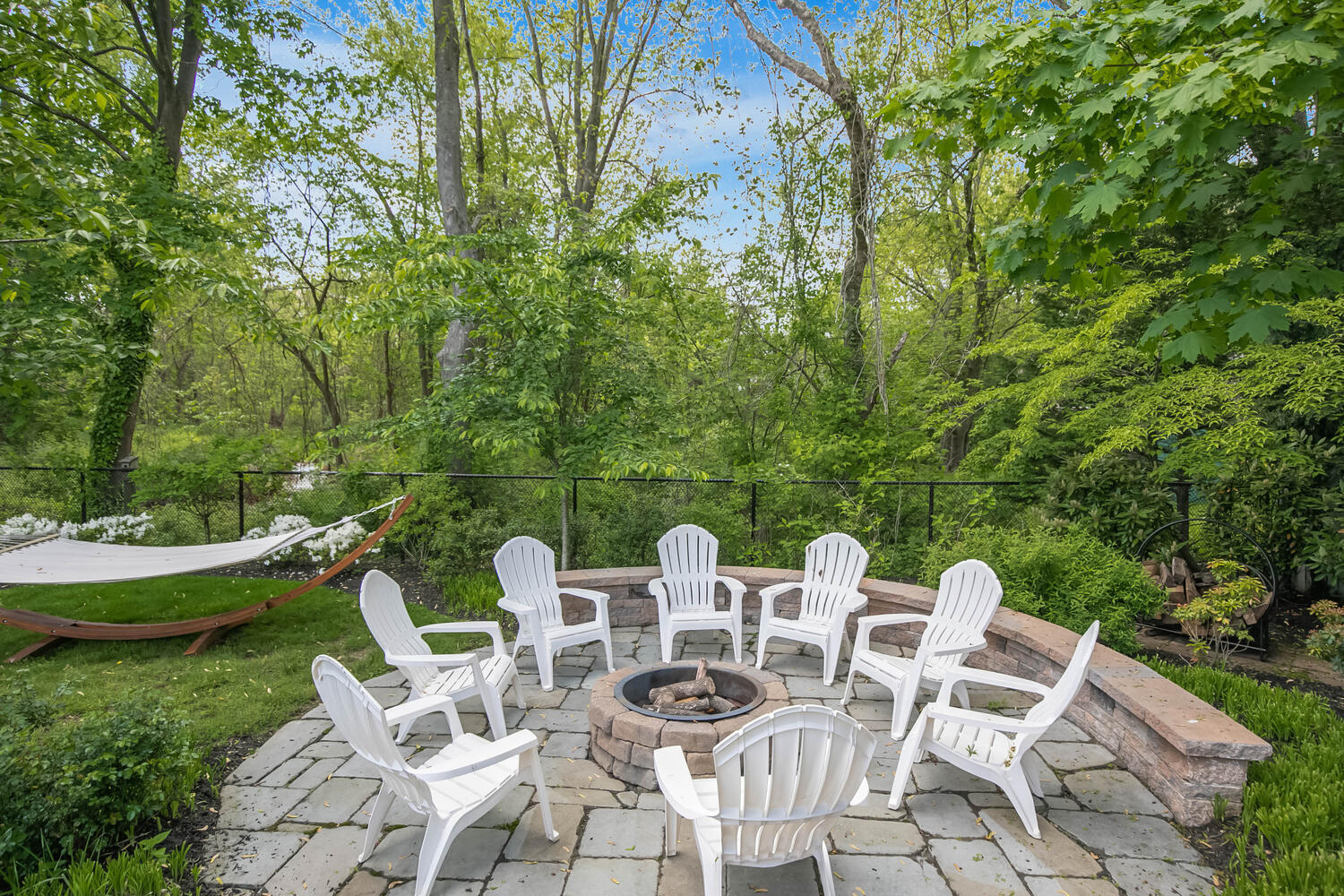 114 Garden Road Shrewsbury, NJ 07702 - Photo 24 of 25 a view of a patio with a dining table and chairs with two large trees