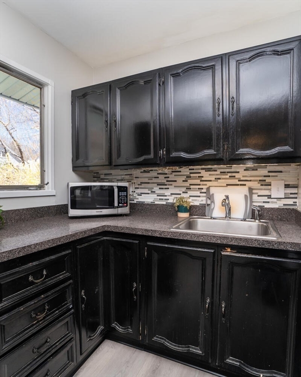 392 Bridge Street Northampton, MA 01060 - Photo 12 of 36 a kitchen with cabinets stainless steel appliances and sink