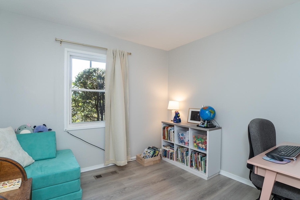 392 Bridge Street Northampton, MA 01060 - Photo 17 of 36 a living room with furniture and a window