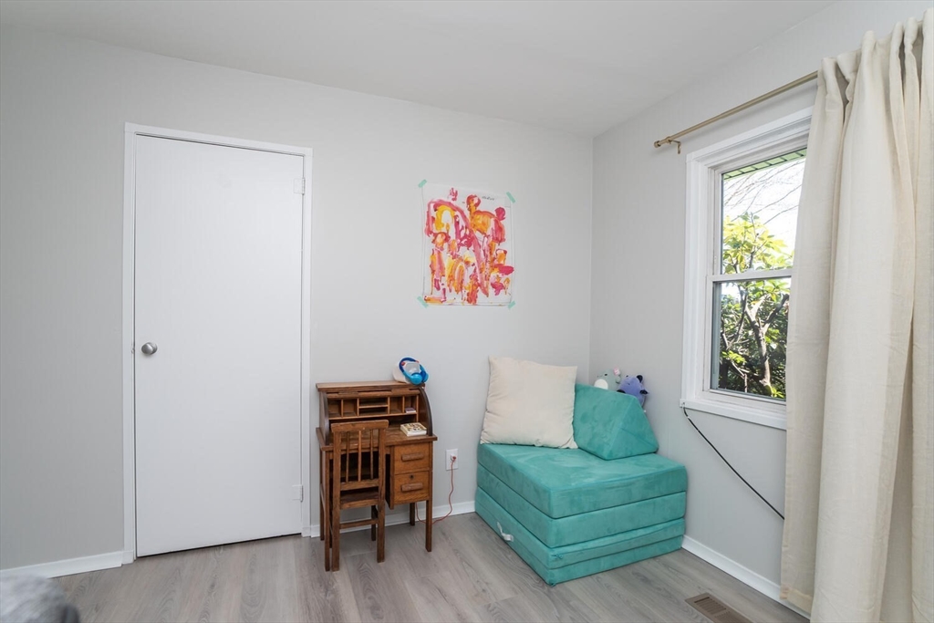 392 Bridge Street Northampton, MA 01060 - Photo 18 of 36 a living room with furniture and a window