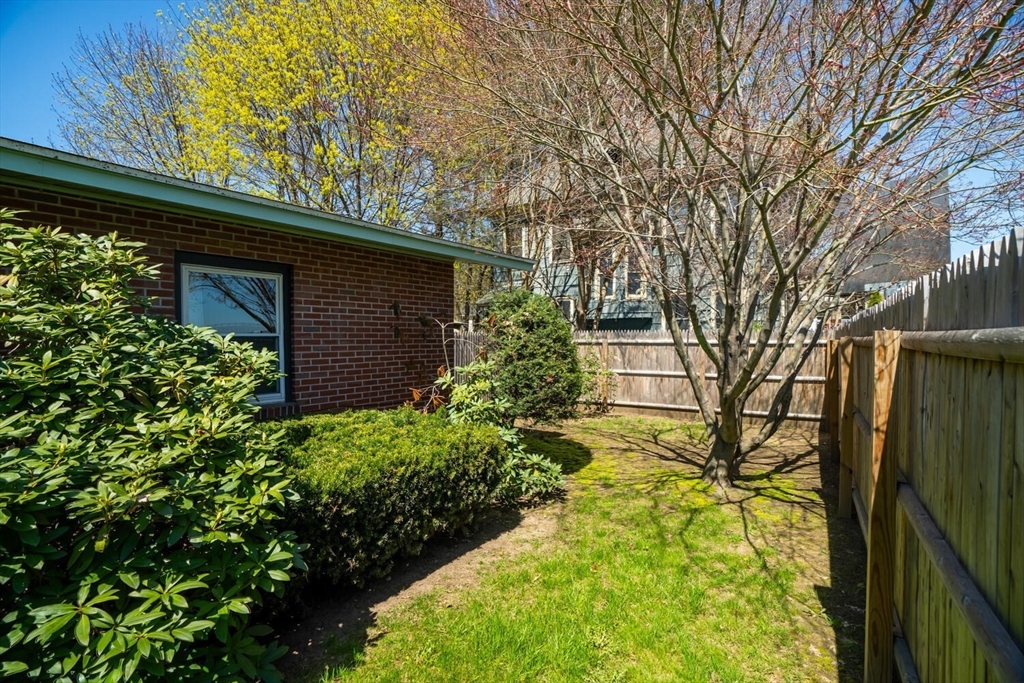 392 Bridge Street Northampton, MA 01060 - Photo 21 of 36 a backyard of a house with lots of green space