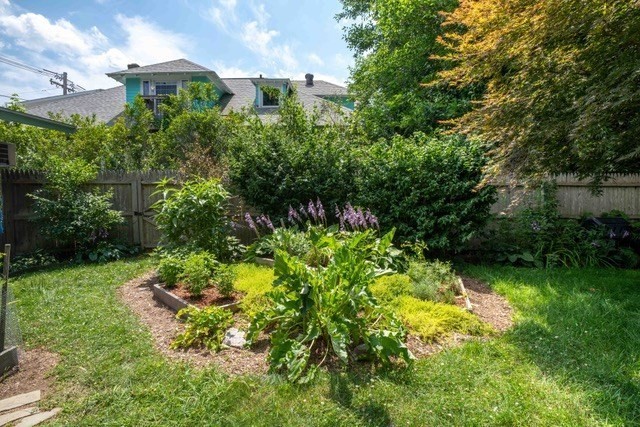 392 Bridge Street Northampton, MA 01060 - Photo 31 of 36 a backyard of a house with lots of green space and garden