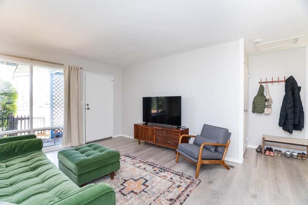 392 Bridge Street Northampton, MA 01060 - Photo 5 of 36 a living room with furniture and a flat screen tv