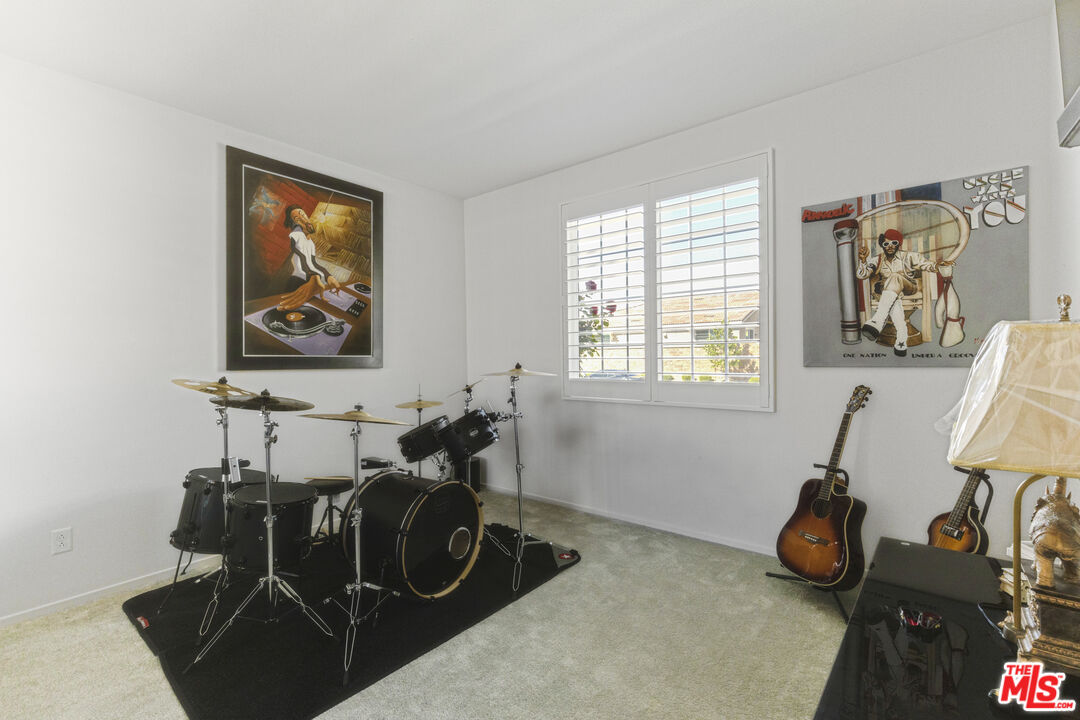 24477 Oneida Street Moreno Valley, CA 92553 - Photo 13 of 51 a room with gym equipment and a window