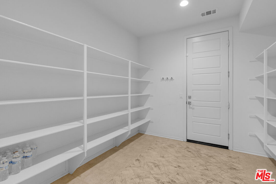 24477 Oneida Street Moreno Valley, CA 92553 - Photo 20 of 51 a view of an empty walk in closet
