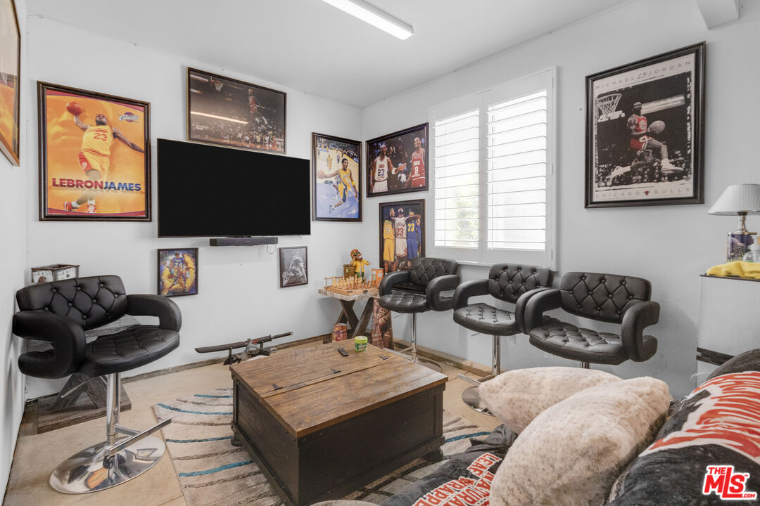 24477 Oneida Street Moreno Valley, CA 92553 - Photo 21 of 51 a living room with furniture and a flat screen tv