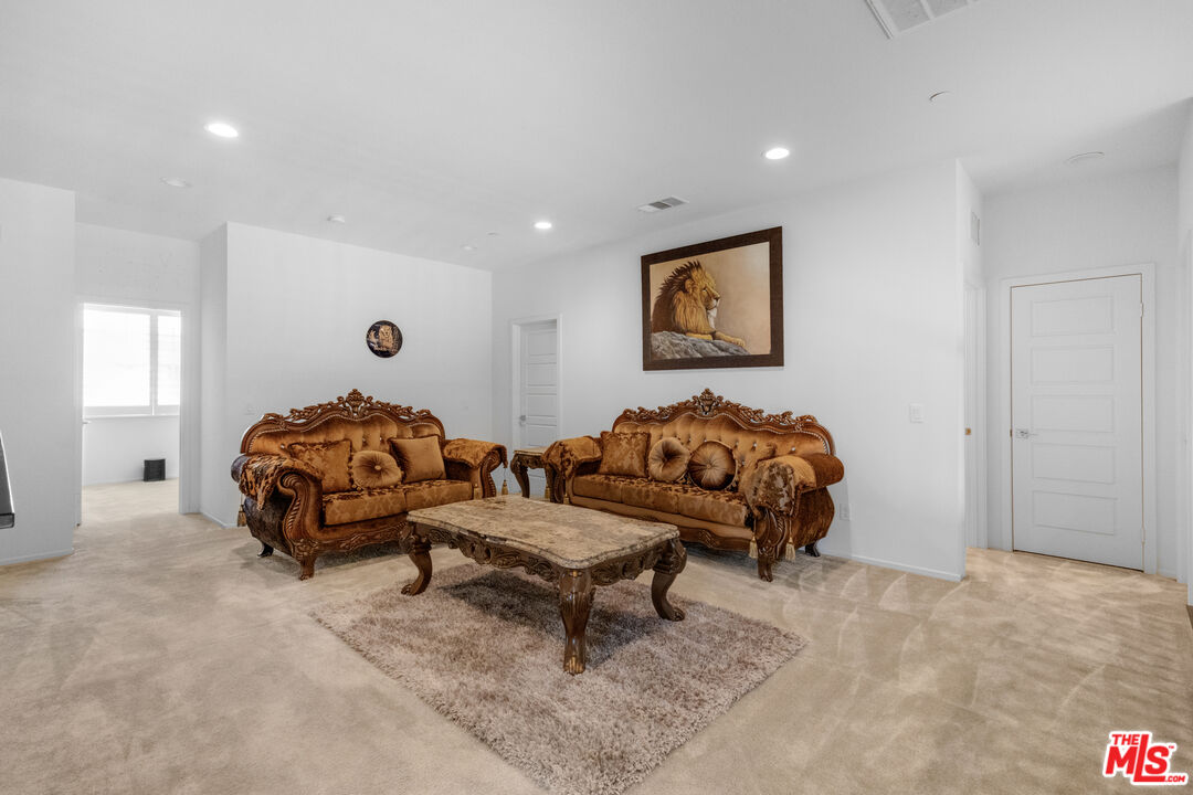 24477 Oneida Street Moreno Valley, CA 92553 - Photo 22 of 51 a living room with furniture and a large window