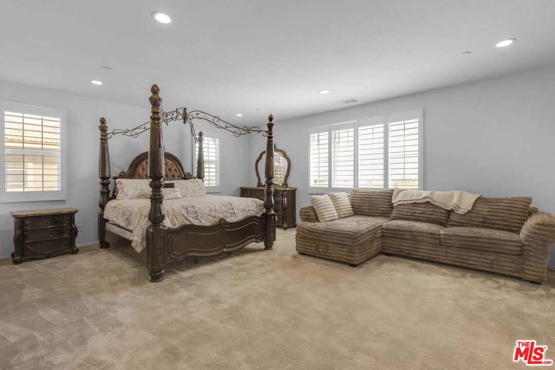 24477 Oneida Street Moreno Valley, CA 92553 - Photo 23 of 51 a bedroom with bed couch and window