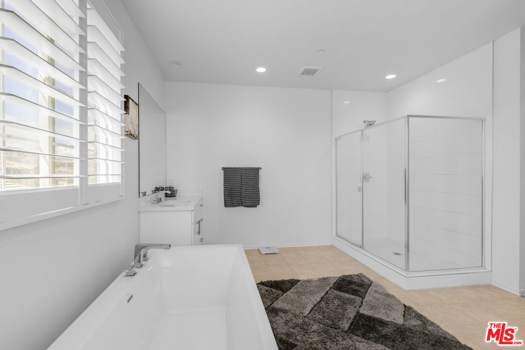 24477 Oneida Street Moreno Valley, CA 92553 - Photo 27 of 51 a bedroom with a bed and a window