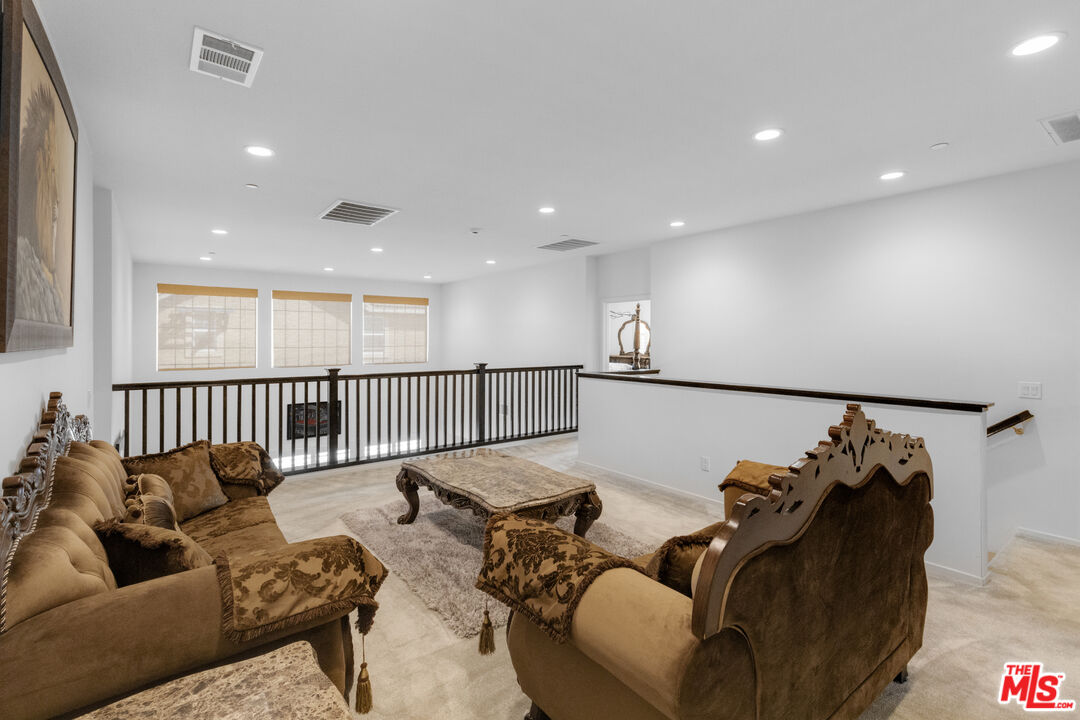 24477 Oneida Street Moreno Valley, CA 92553 - Photo 28 of 51 a living room with furniture and a window