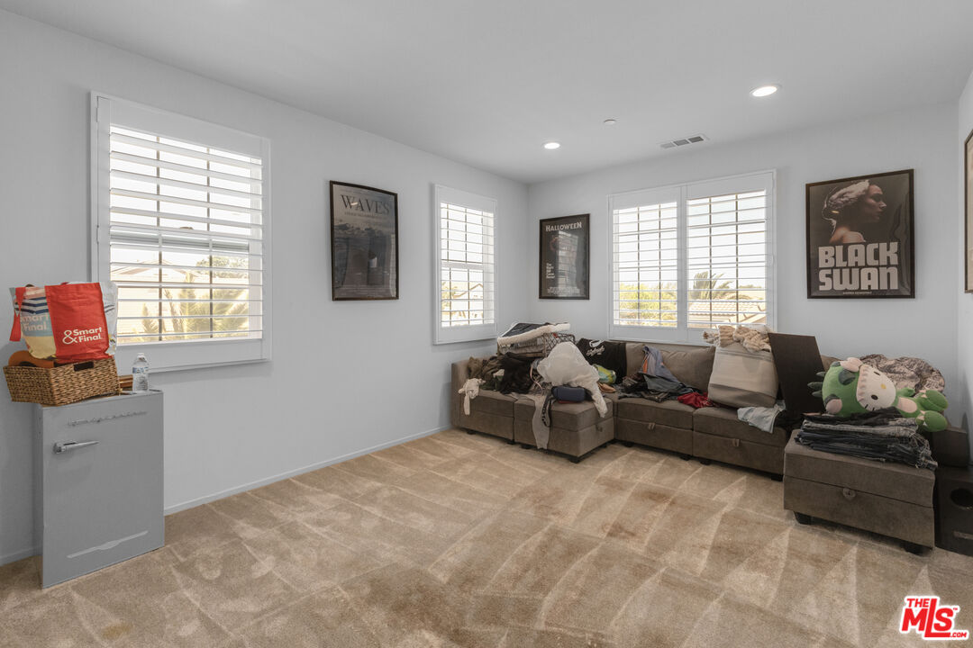 24477 Oneida Street Moreno Valley, CA 92553 - Photo 29 of 51 a living room with furniture and windows
