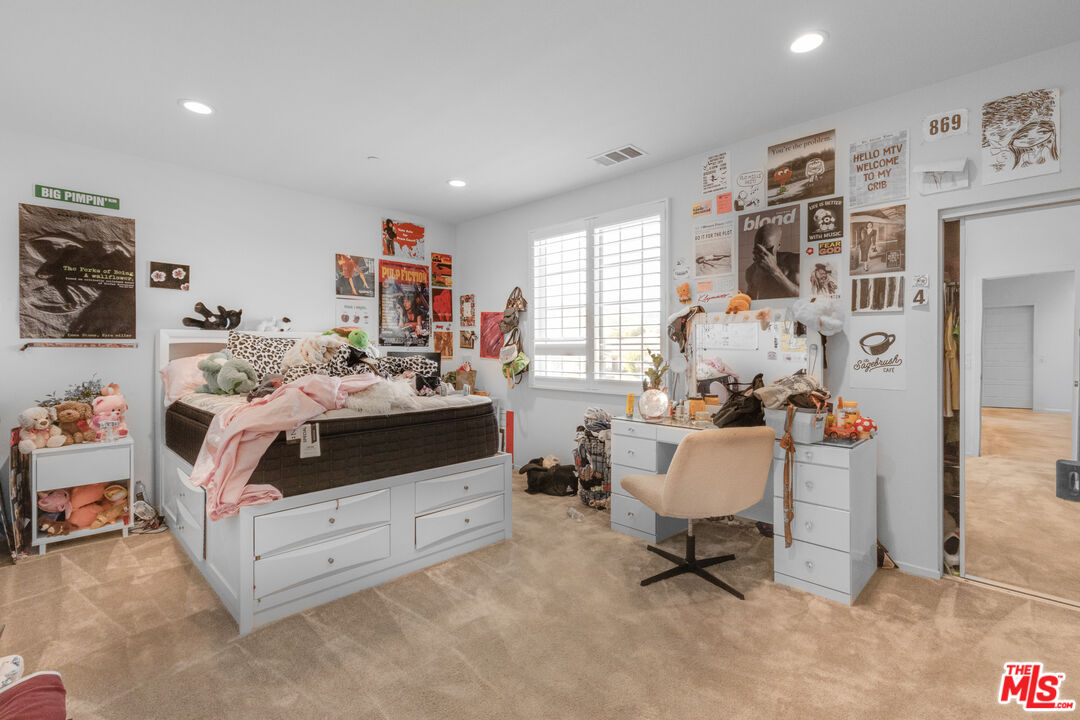 24477 Oneida Street Moreno Valley, CA 92553 - Photo 32 of 51 a bedroom with furniture and a large window