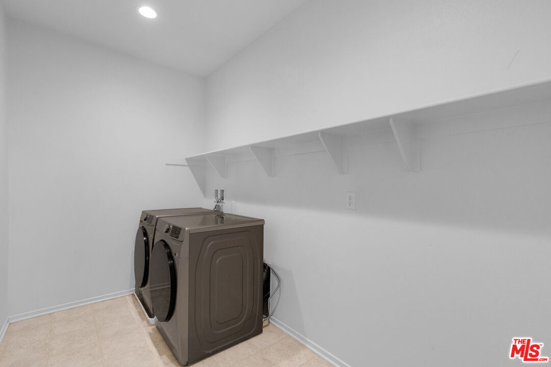 24477 Oneida Street Moreno Valley, CA 92553 - Photo 35 of 51 a utility room with dryer and washer