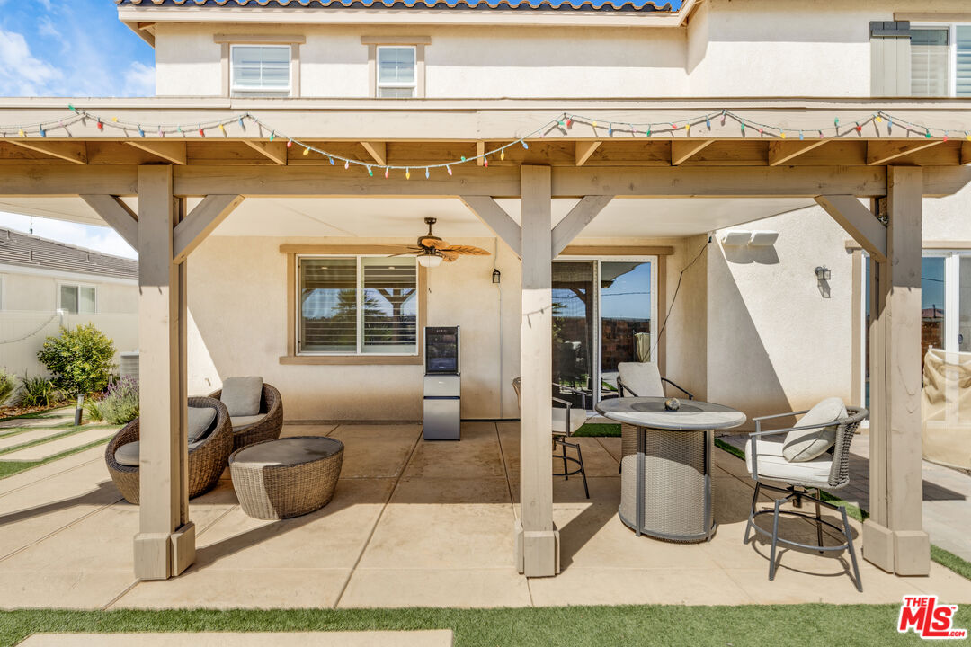 24477 Oneida Street Moreno Valley, CA 92553 - Photo 40 of 51 a view of a patio with table and chairs
