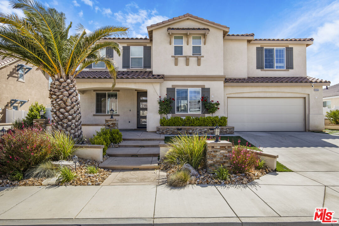 24477 Oneida Street Moreno Valley, CA 92553 - Photo 4 of 51 a front view of a house with a garden