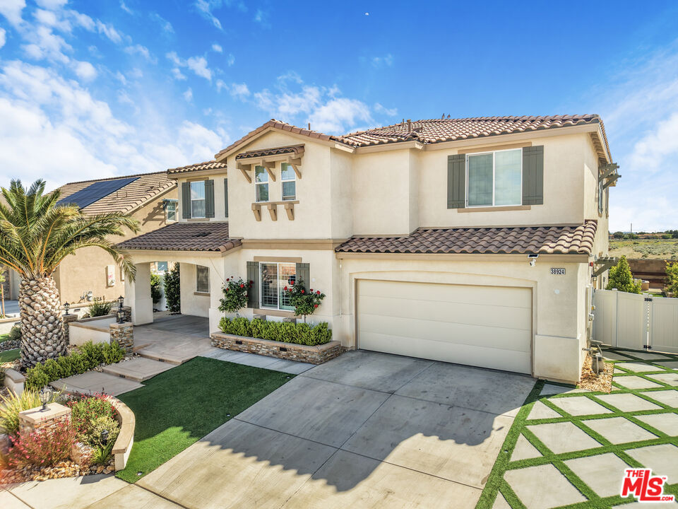 24477 Oneida Street Moreno Valley, CA 92553 - Photo 42 of 51 a view of a white house with a yard and furniture