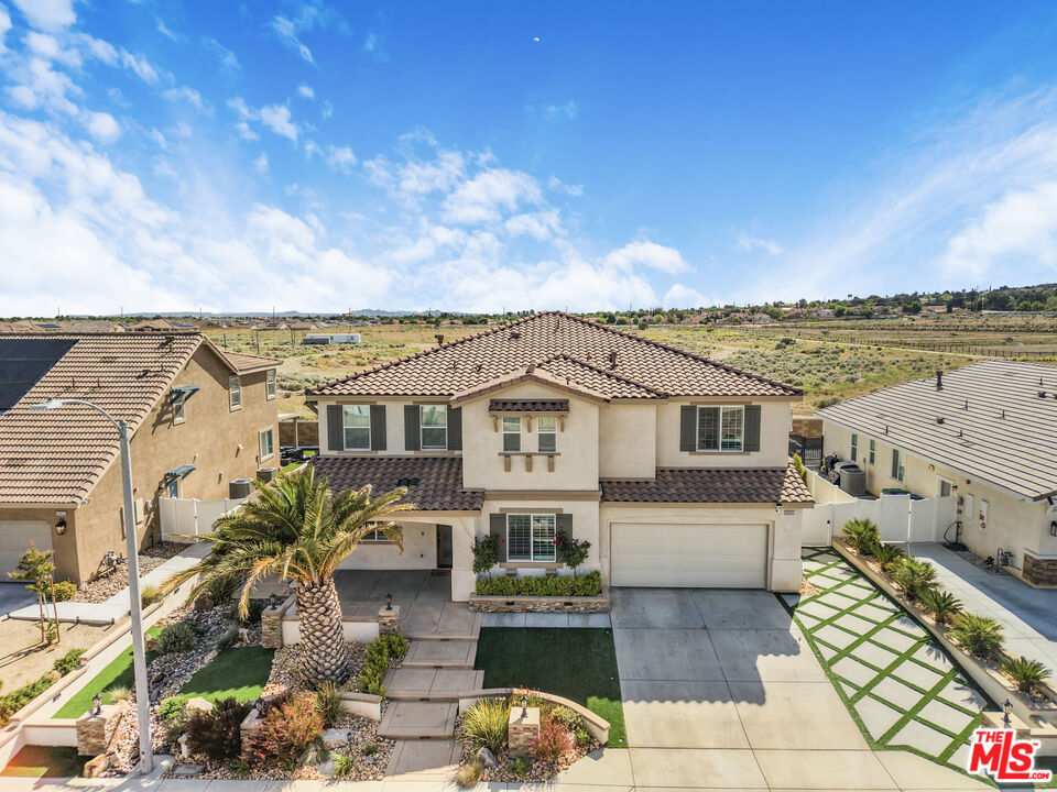 24477 Oneida Street Moreno Valley, CA 92553 - Photo 44 of 51 a front view of a house with a garden