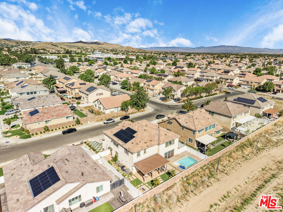 24477 Oneida Street Moreno Valley, CA 92553 - Photo 51 of 51 an aerial view of residential building with parking