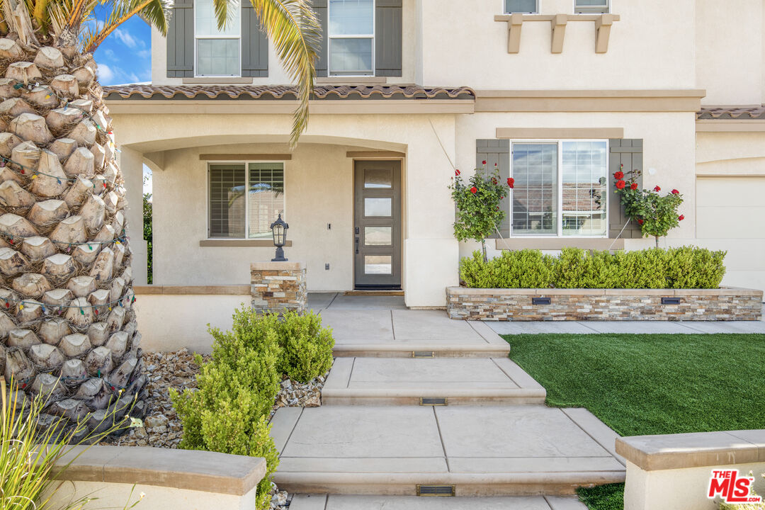 24477 Oneida Street Moreno Valley, CA 92553 - Photo 7 of 51 front view of a house with a yard