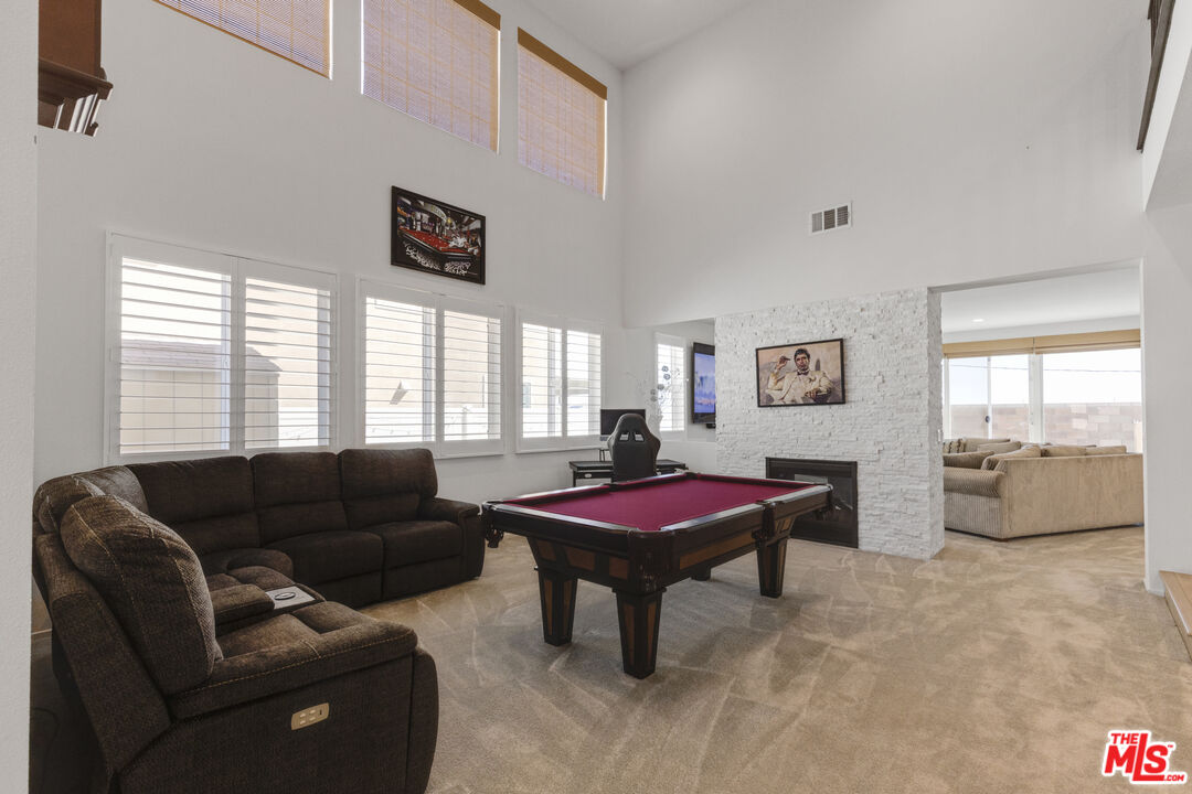 24477 Oneida Street Moreno Valley, CA 92553 - Photo 8 of 51 a living room with furniture and a large window