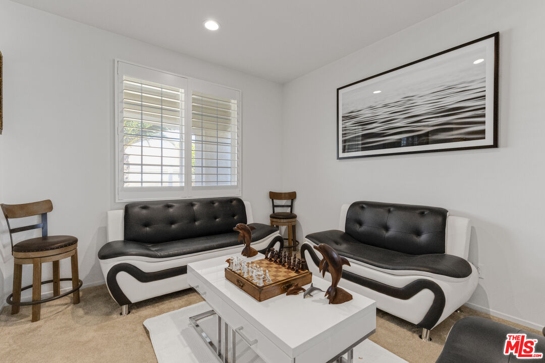24477 Oneida Street Moreno Valley, CA 92553 - Photo 10 of 51 a living room with furniture and a window