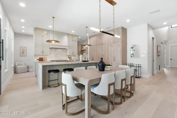 a kitchen with a sink a counter top space stainless steel appliances cabinets and a window