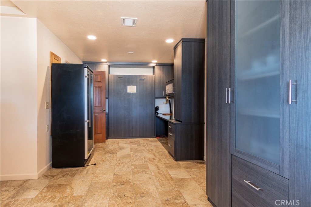 1675 Adobe Road Paso Robles, CA 93446 - Photo 16 of 34 Murphy bed hidden among the office area of the utility room